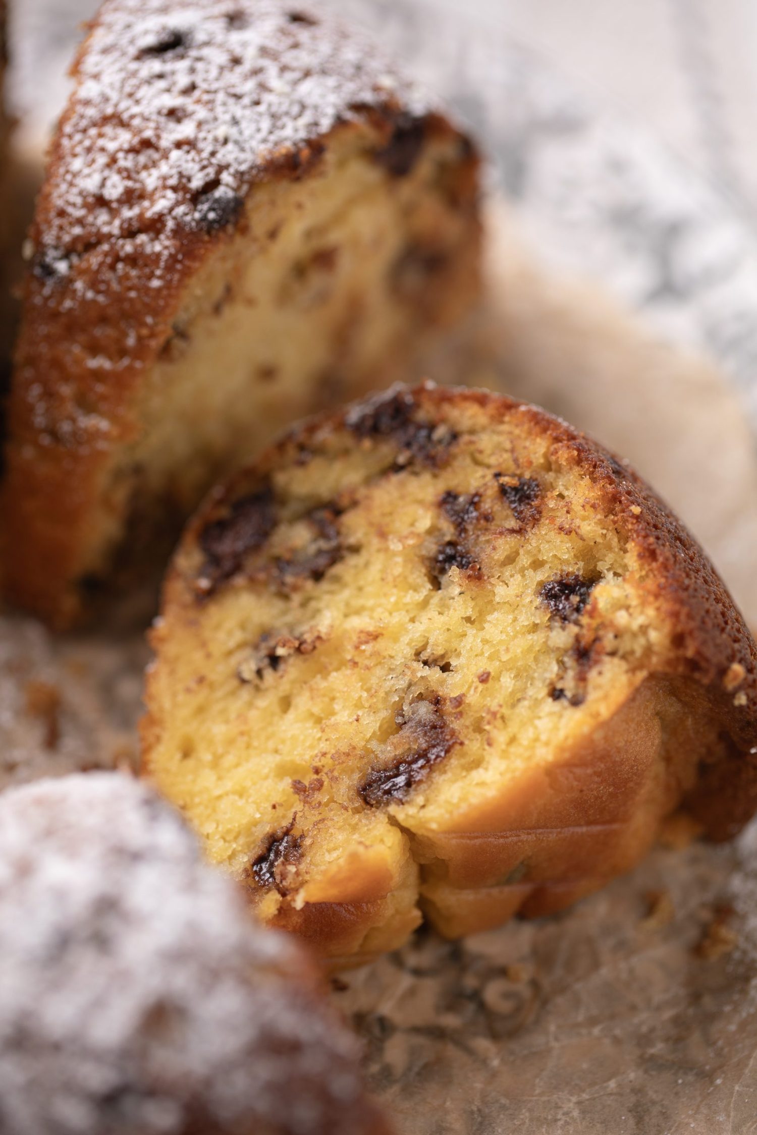A texture shot showcasing the interior of a doctored cake mix cake with chocolate chips.