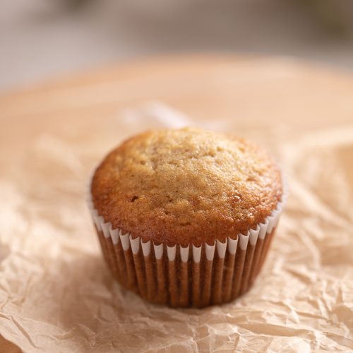 A banana muffin on a stand.